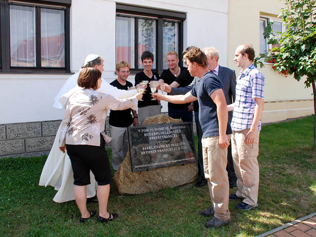 Making a toast for the newly unveiled memorial plaque. Photo: Milos Kratochvíl