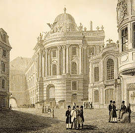 The old Hofburg theatre in Vienna is the low building to the right